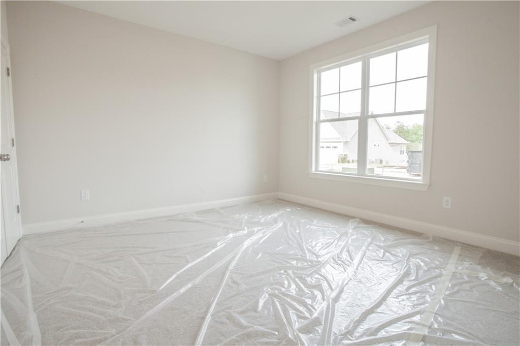 388 Maple View Drive Carrollton, GA 30117 - Photo 13 of 18 an empty room with a window