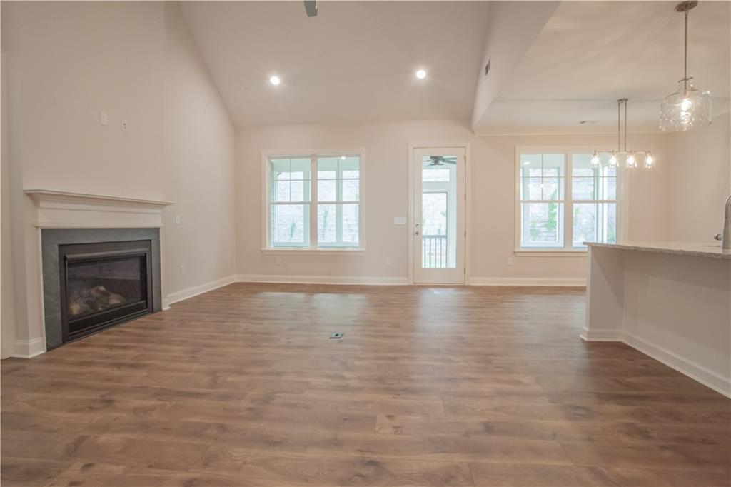388 Maple View Drive Carrollton, GA 30117 - Photo 7 of 18 an empty room with windows and fireplace