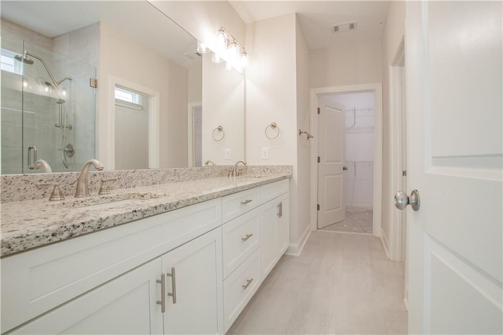 388 Maple View Drive Carrollton, GA 30117 - Photo 10 of 18 a bathroom with a granite countertop sink mirror and