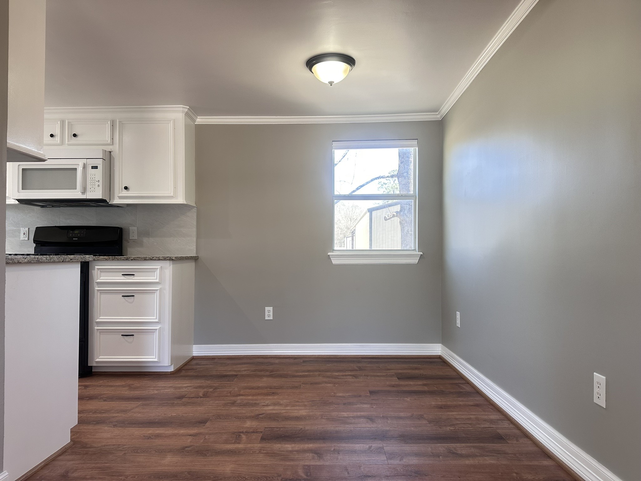 13868 Cedar Hill Road Montgomery, TX 77356 - Photo 6 of 19 a view of an empty room with a window and wooden floor