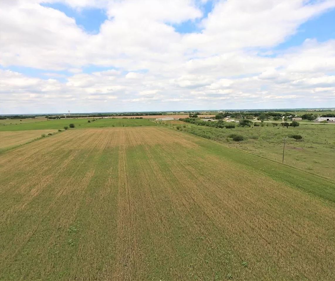 11609 Highway 36 Temple, TX 76502 - Photo 4 of 6 Cultivated fields stretch across the landscape under an open sky, offering abundant agricultural opportunities.