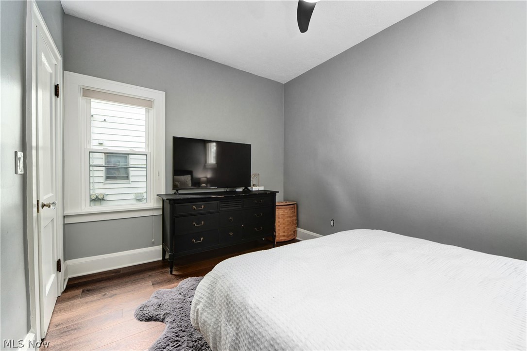 7408-7410 Rutledge Avenue Cleveland, OH 44102 - Photo 21 of 46 Bedroom featuring ceiling fan and hardwood / wood-style floors