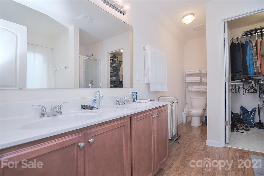607 Hunley Street Monroe, NC 28112 - Photo 17 of 29 a en suite bathroom with a double vanity sink and a mirror