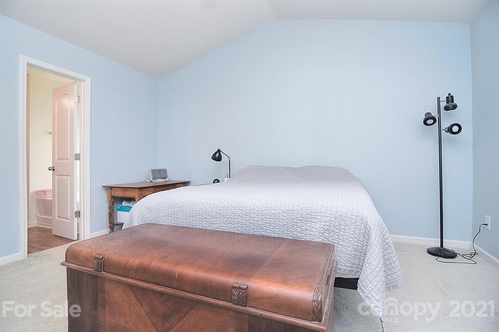 607 Hunley Street Monroe, NC 28112 - Photo 21 of 29 a bedroom with a bed and a window