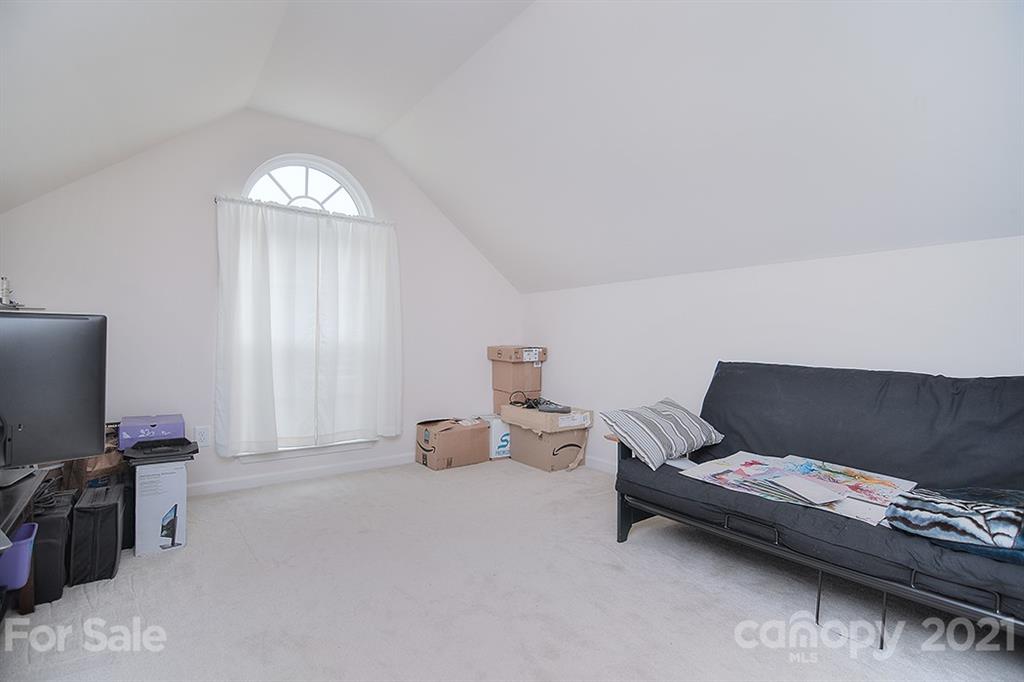 607 Hunley Street Monroe, NC 28112 - Photo 23 of 29 a living room with furniture and a flat screen tv