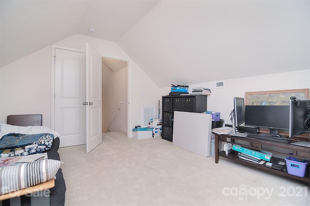 607 Hunley Street Monroe, NC 28112 - Photo 24 of 29 a bedroom with a workspace