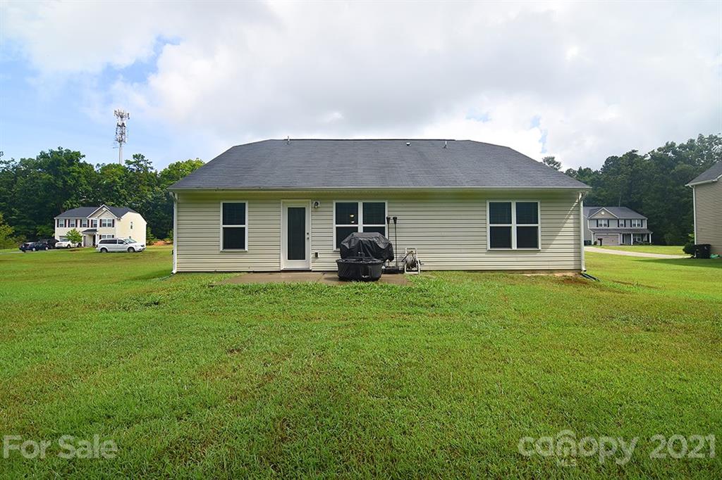 607 Hunley Street Monroe, NC 28112 - Photo 26 of 29 a view of a house with backyard