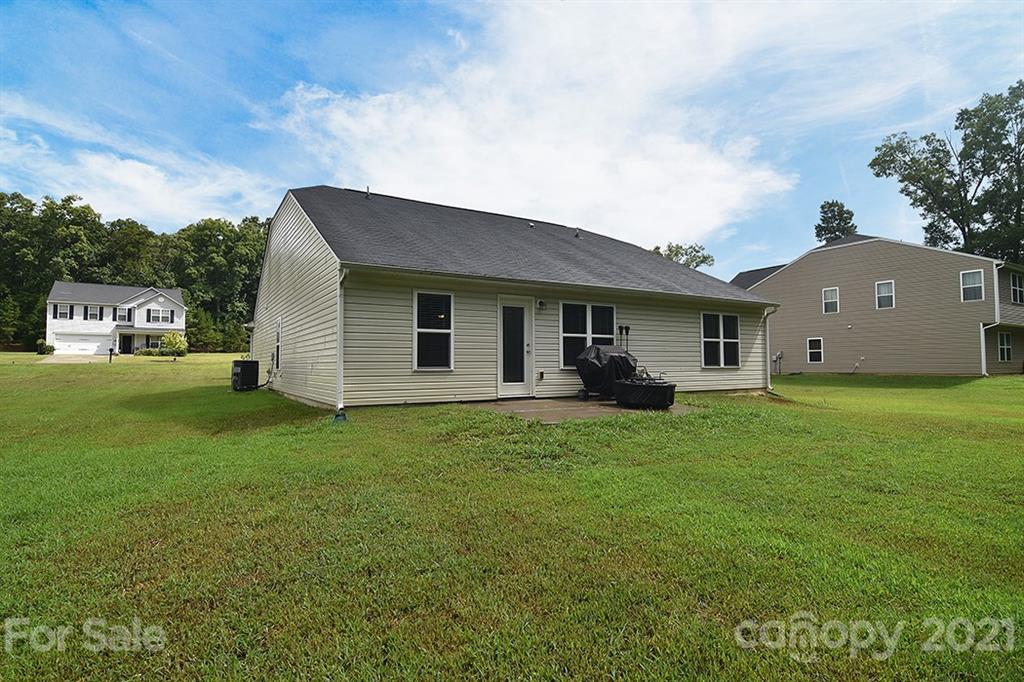 607 Hunley Street Monroe, NC 28112 - Photo 27 of 29 a view of a house with a backyard