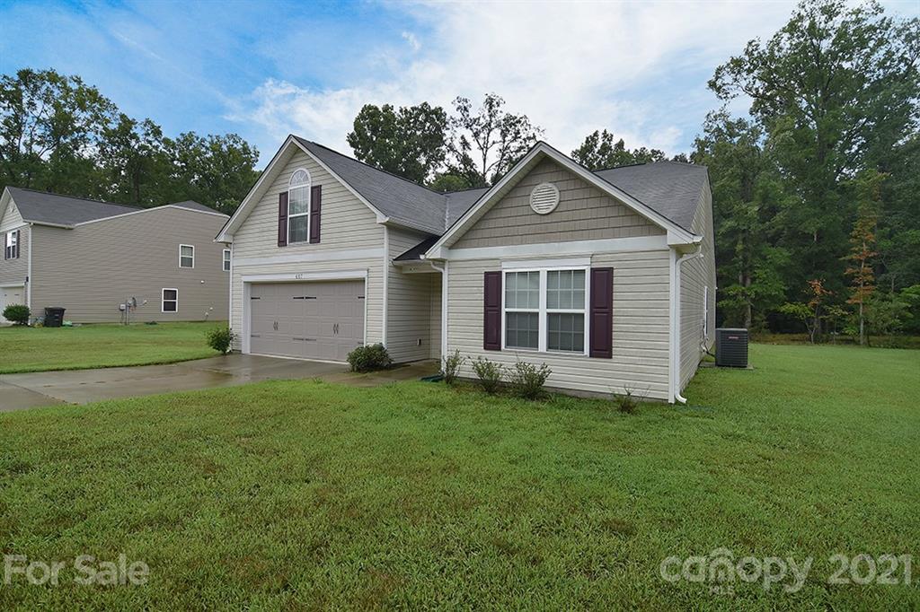 607 Hunley Street Monroe, NC 28112 - Photo 28 of 29 a view of a house with a yard