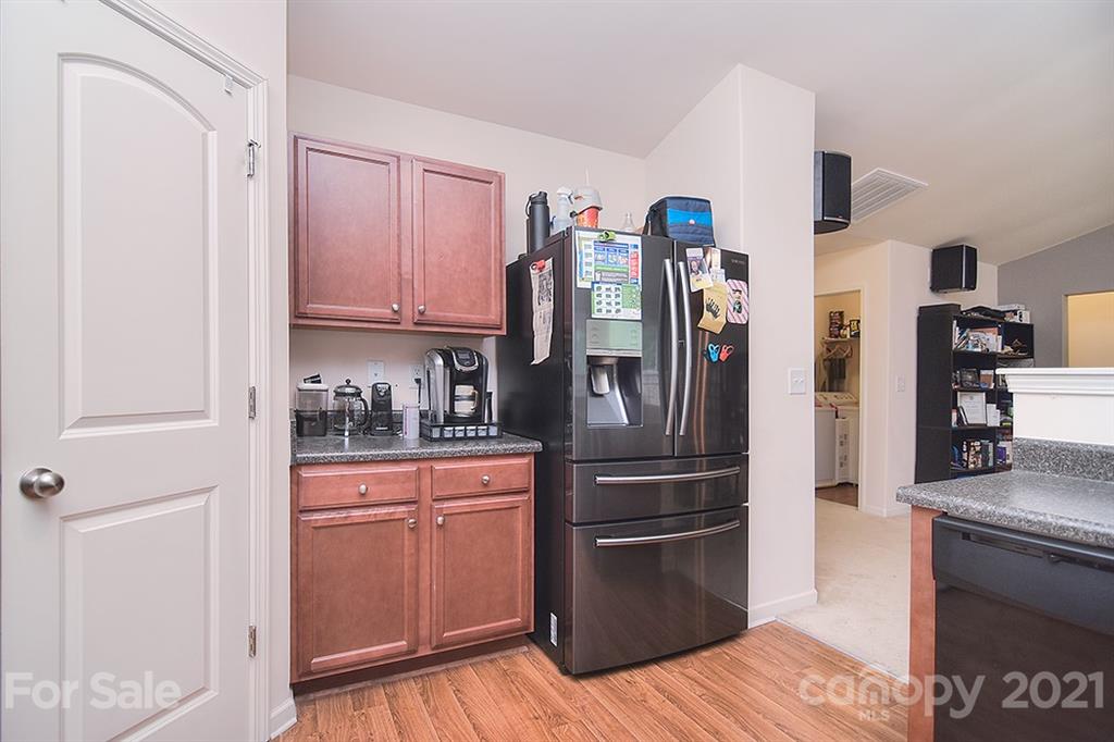 607 Hunley Street Monroe, NC 28112 - Photo 6 of 29 a kitchen with stainless steel appliances granite countertop a refrigerator and a sink