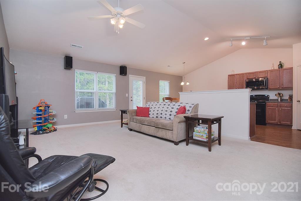 607 Hunley Street Monroe, NC 28112 - Photo 10 of 29 a living room with furniture and a window
