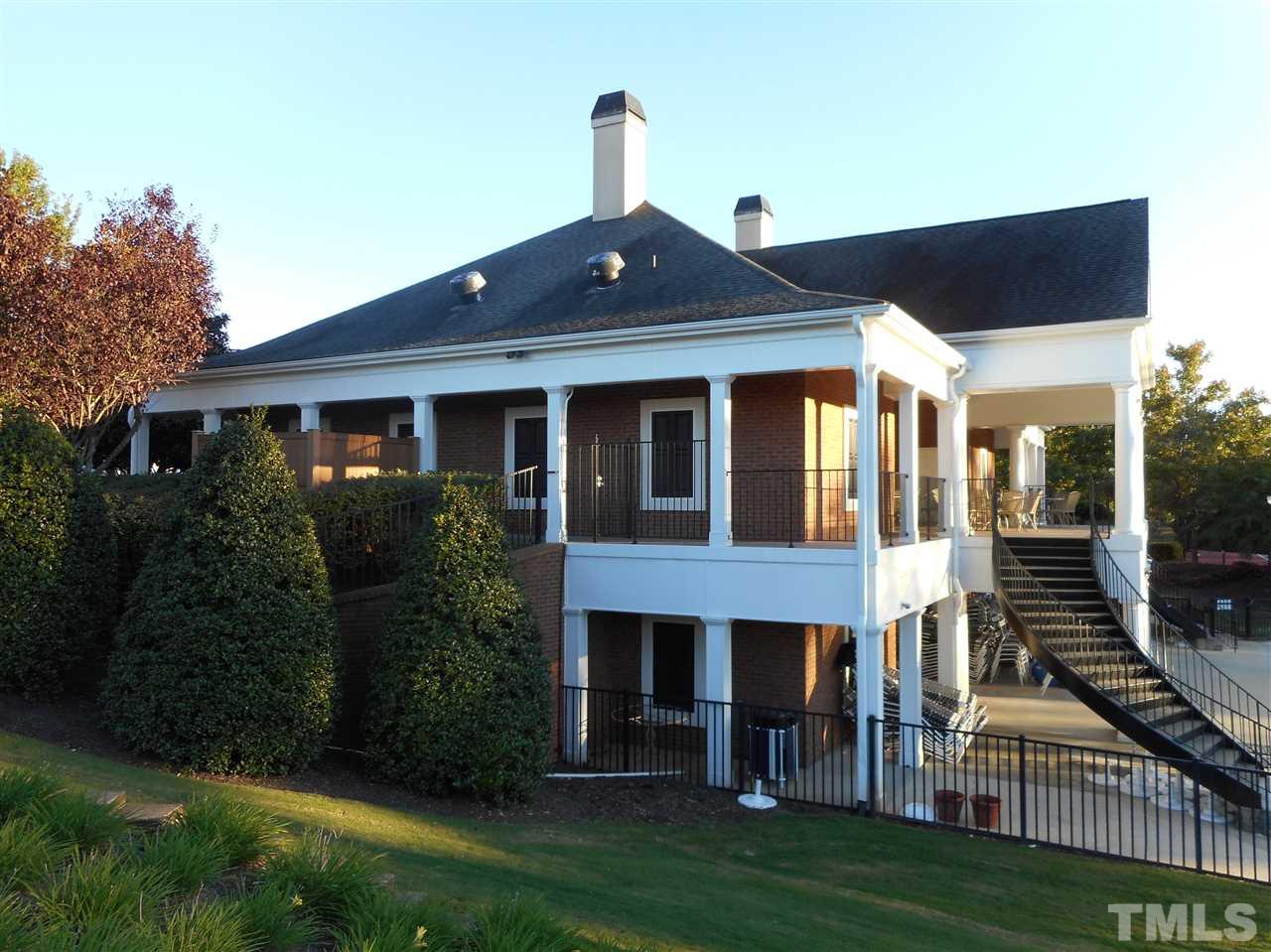 8161 Rhiannon Road Raleigh, NC 27613 - Photo 22 of 22 a front view of a house with a yard