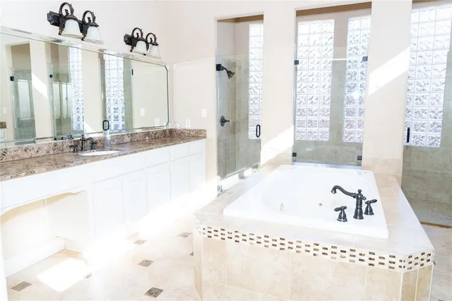 a view of an empty room with closet and a window