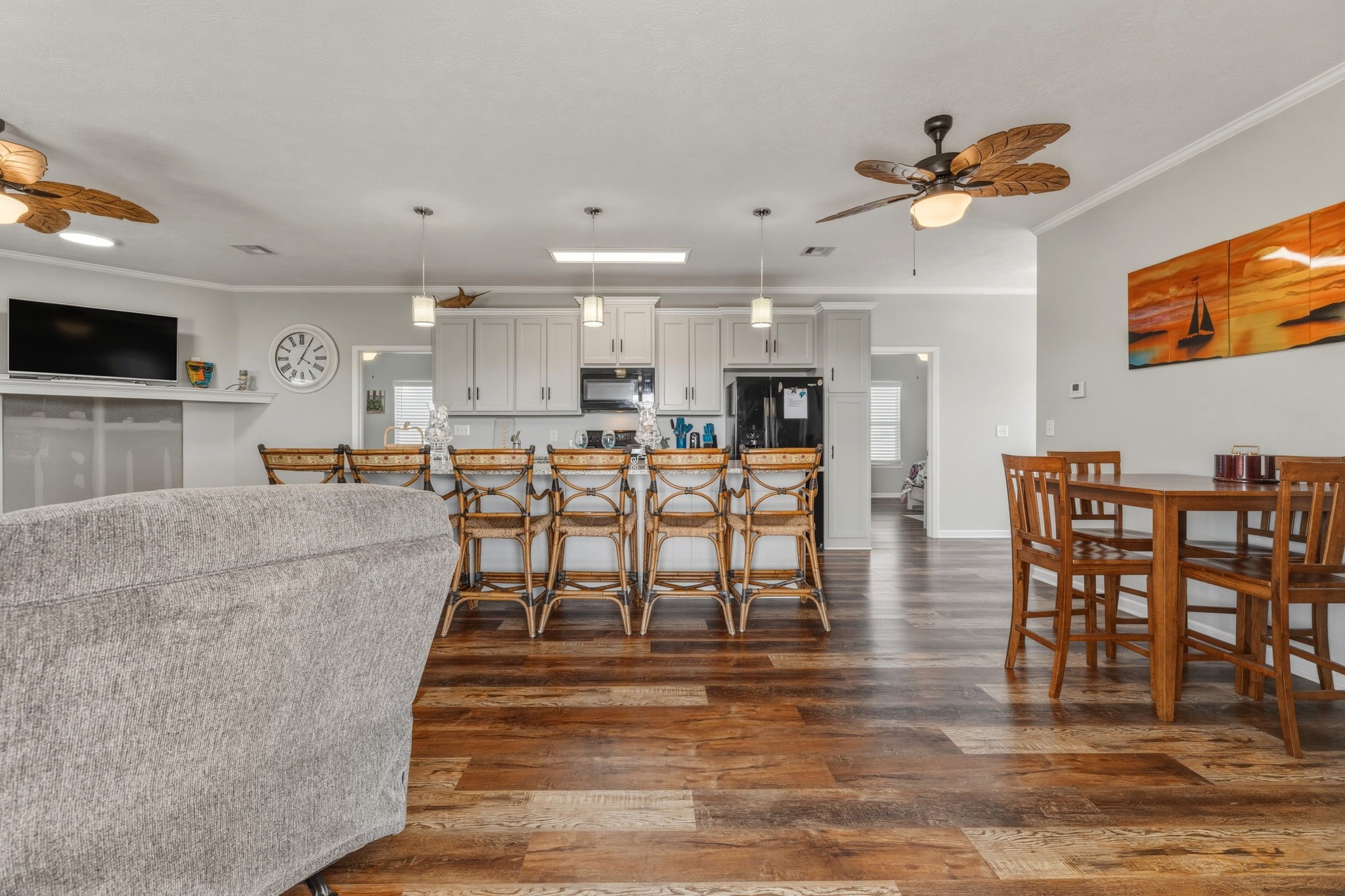 920 Palm View Crystal Beach, TX 77650 - Photo 12 of 26 a living room with stainless steel appliances kitchen island granite countertop a table and chairs with wooden floor