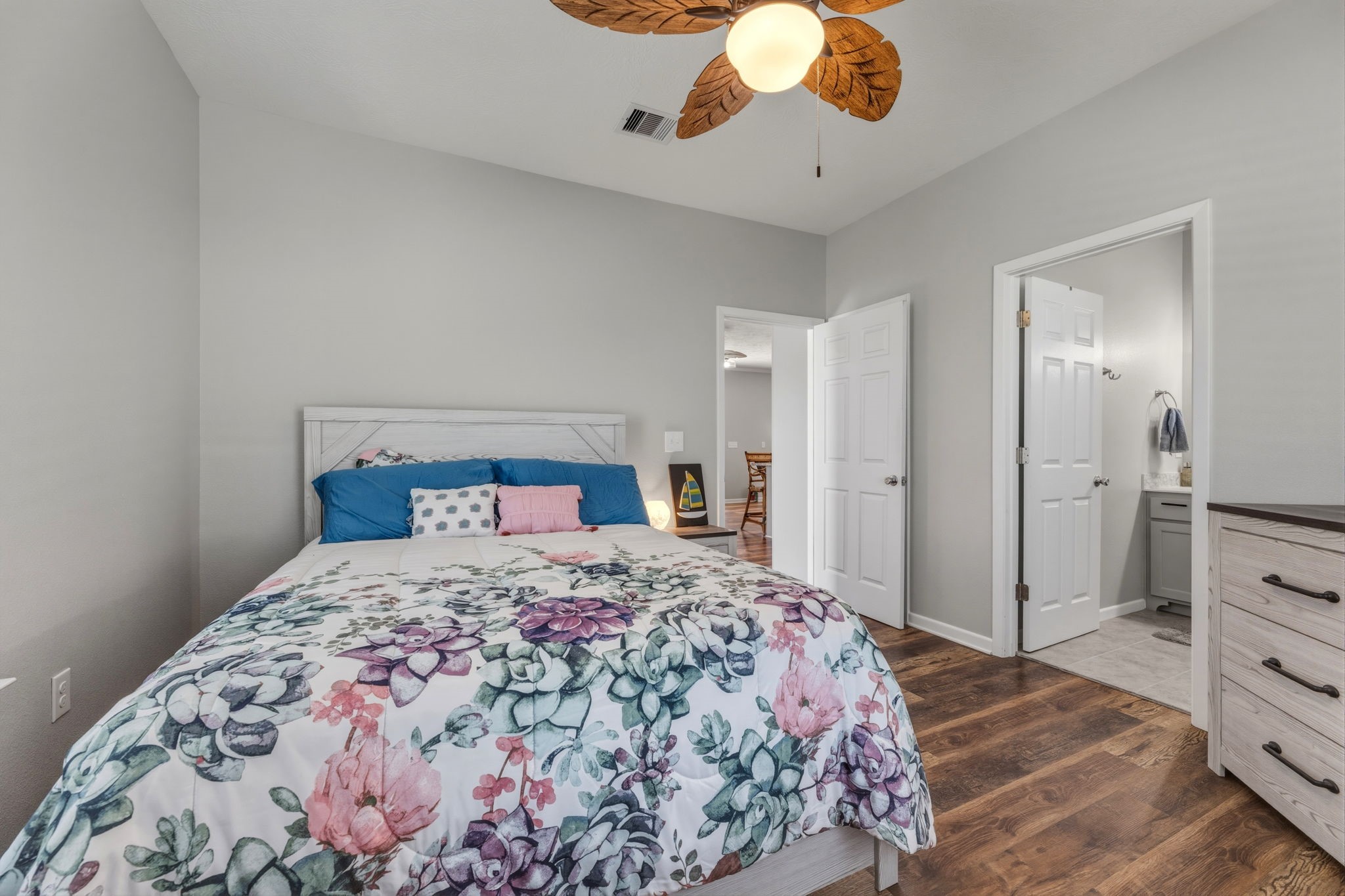 920 Palm View Crystal Beach, TX 77650 - Photo 17 of 26 a bedroom with a large bed and a chandelier