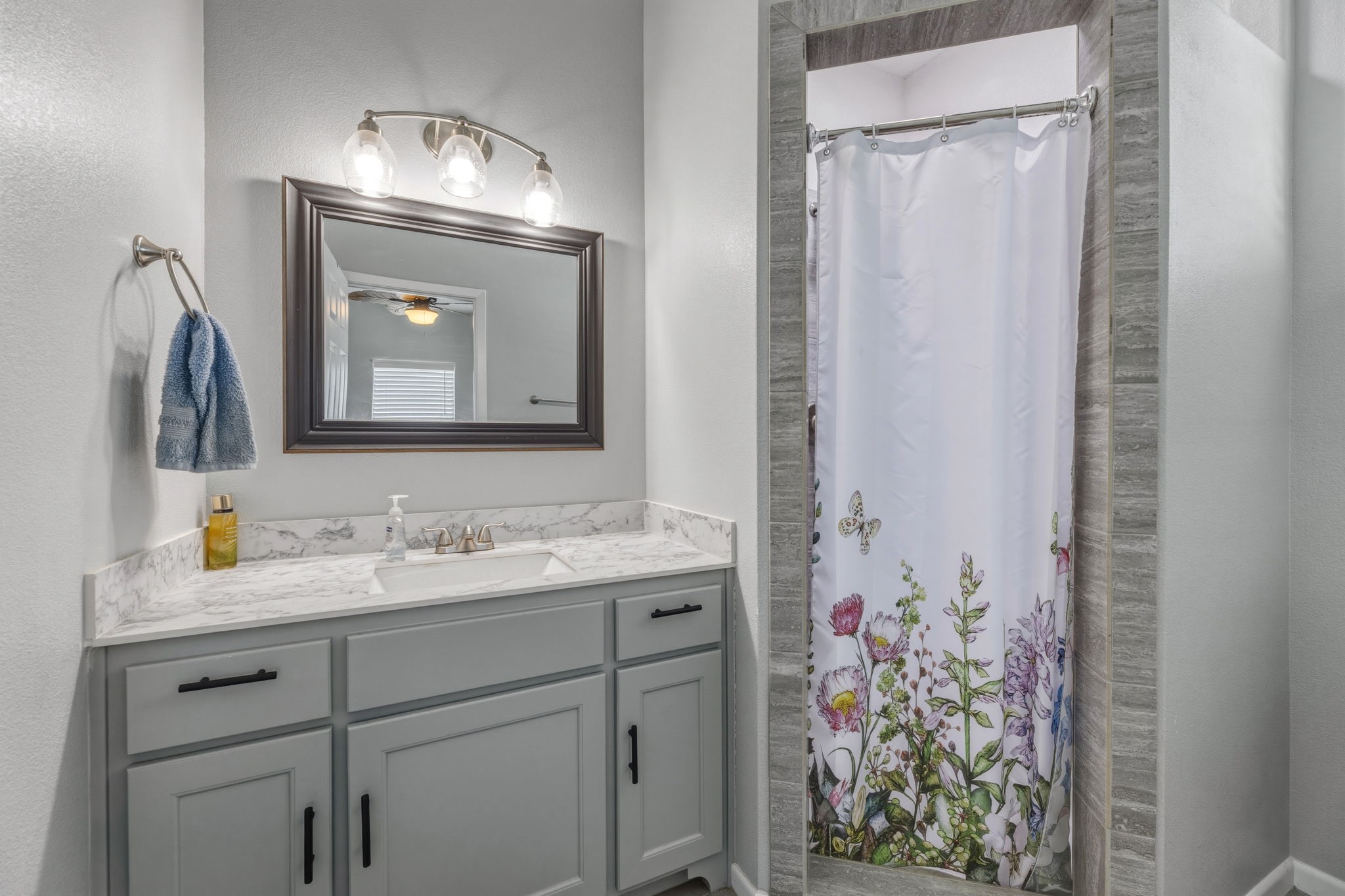 920 Palm View Crystal Beach, TX 77650 - Photo 18 of 26 a bathroom with a sink vanity and a mirror