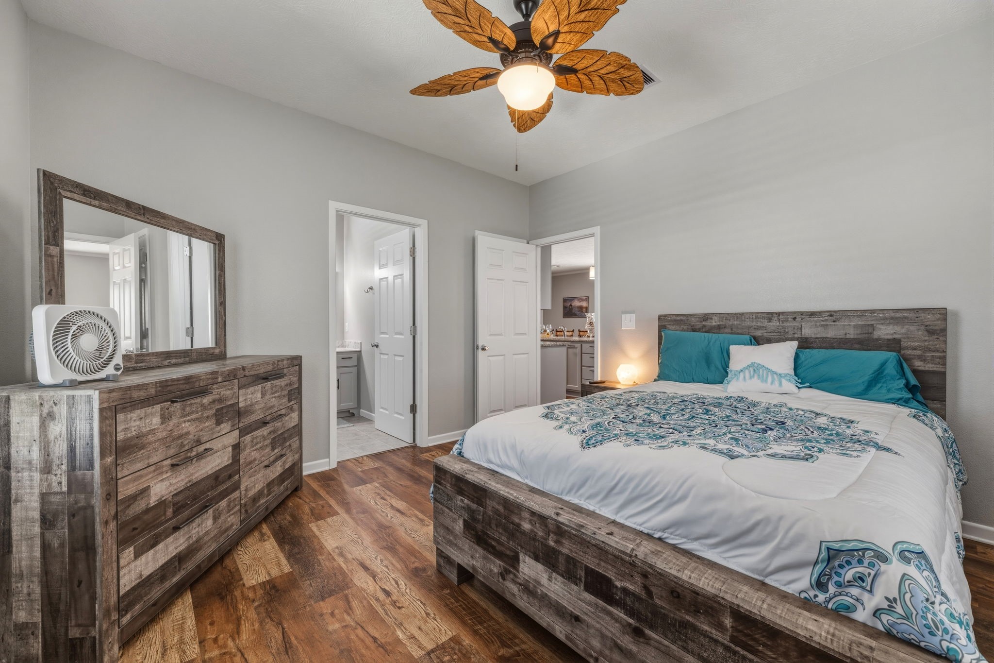 920 Palm View Crystal Beach, TX 77650 - Photo 19 of 26 a bedroom with a bed and a chandelier