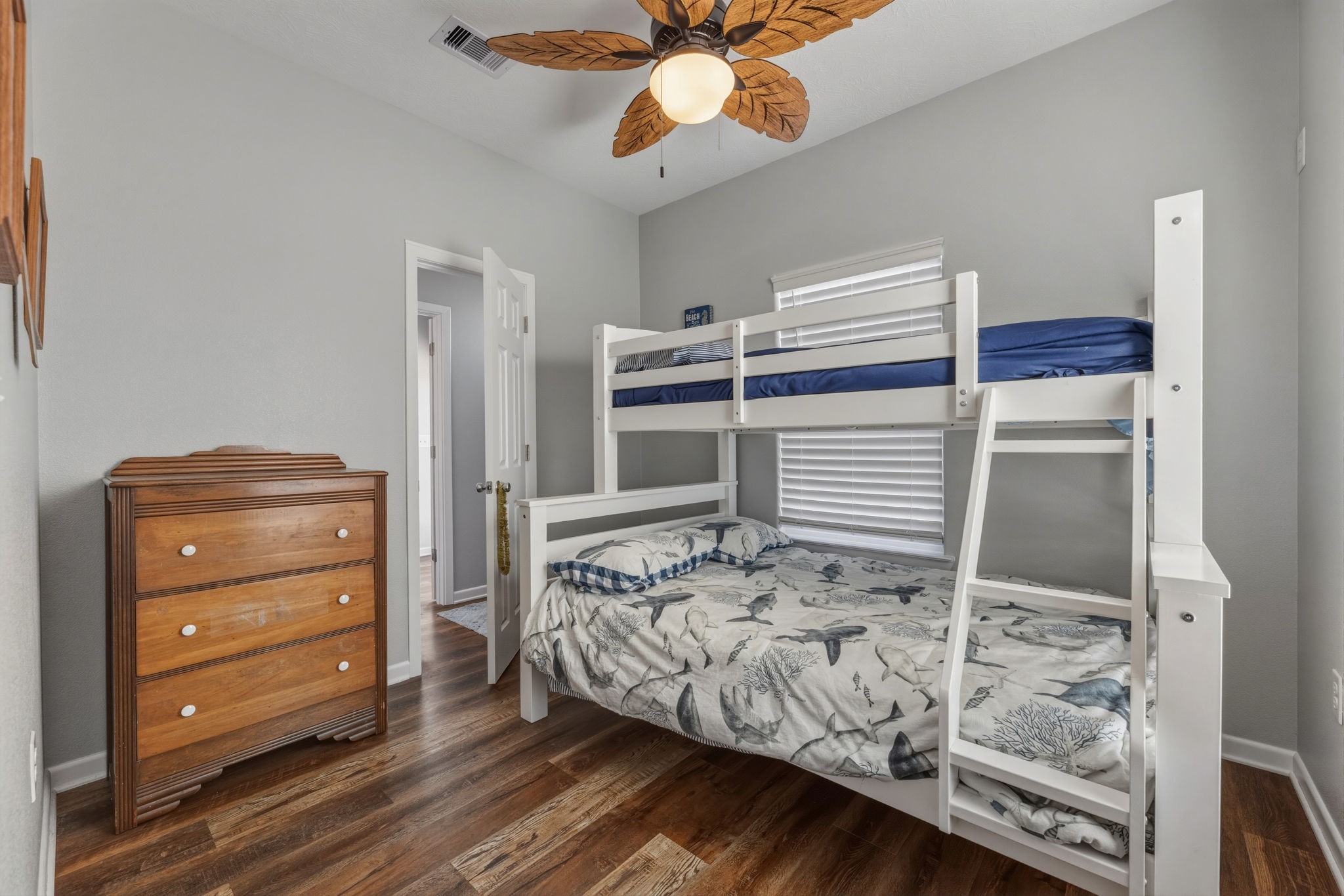 920 Palm View Crystal Beach, TX 77650 - Photo 21 of 26 a bedroom with a bed and a dresser
