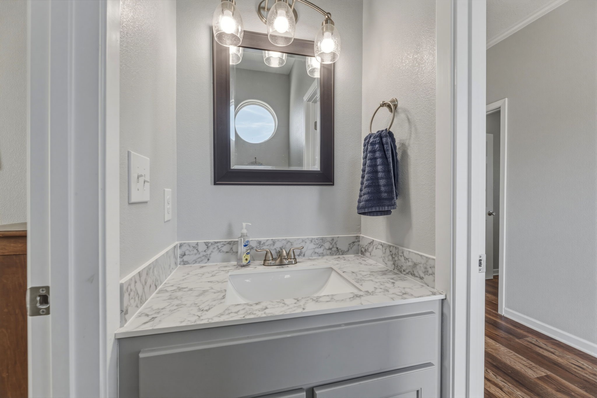 920 Palm View Crystal Beach, TX 77650 - Photo 22 of 26 a bathroom with a granite countertop sink and mirror