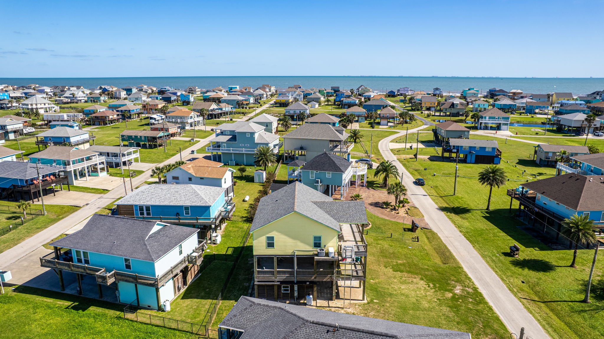 920 Palm View Crystal Beach, TX 77650 - Photo 24 of 26 an aerial view of a house with a swimming pool