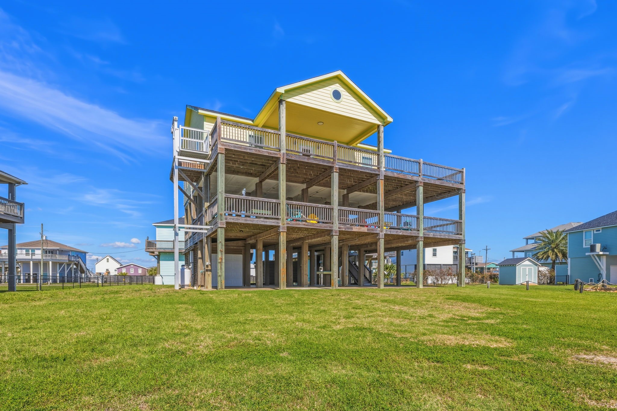 920 Palm View Crystal Beach, TX 77650 - Photo 3 of 26 a view of a building with a yard