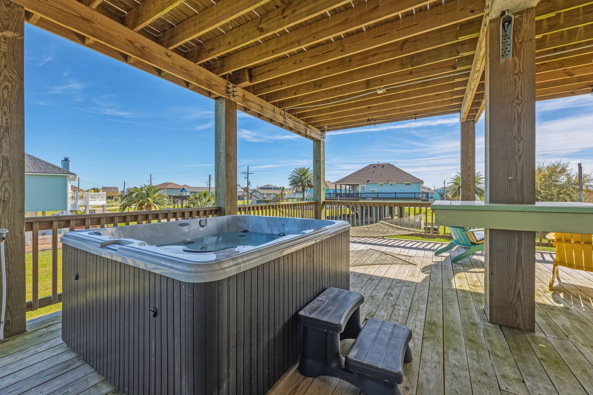 920 Palm View Crystal Beach, TX 77650 - Photo 6 of 26 a terrace with outdoor seating and wooden floor