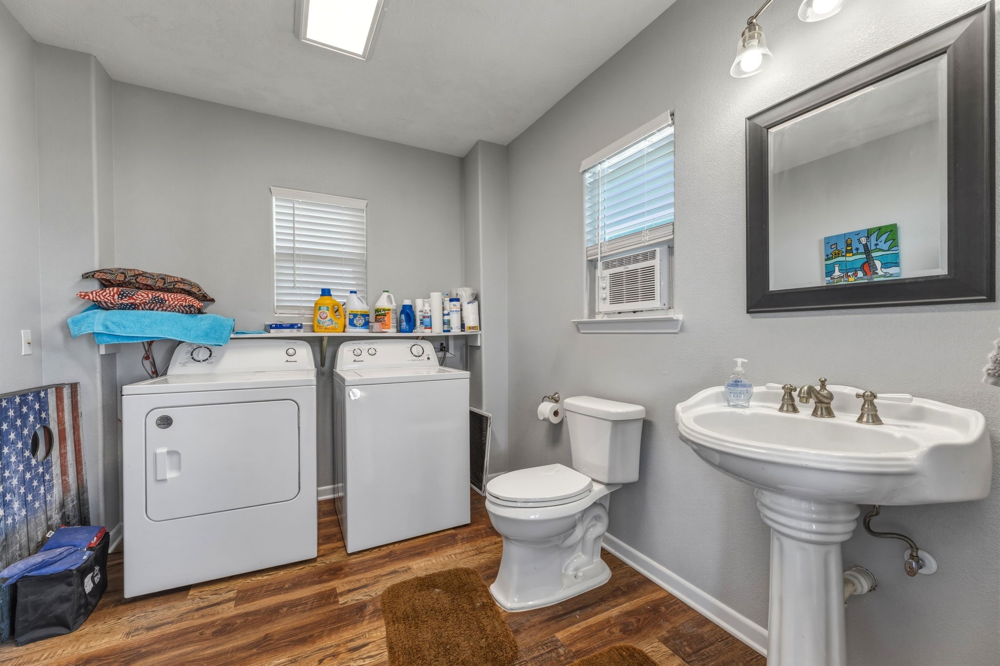 920 Palm View Crystal Beach, TX 77650 - Photo 8 of 26 a bathroom with a sink toilet and a mirror