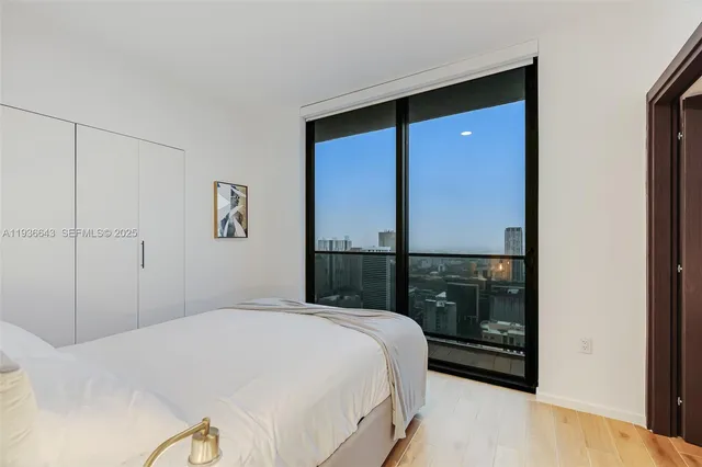 a bathroom with a sink mirror vanity and toilet