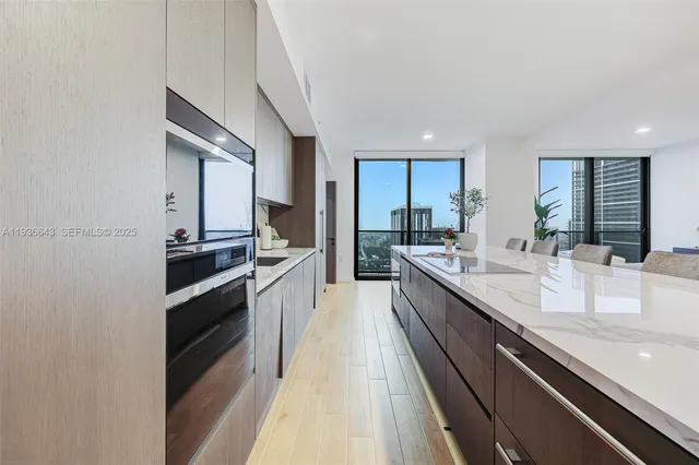 a large kitchen with granite countertop a lot of counter space
