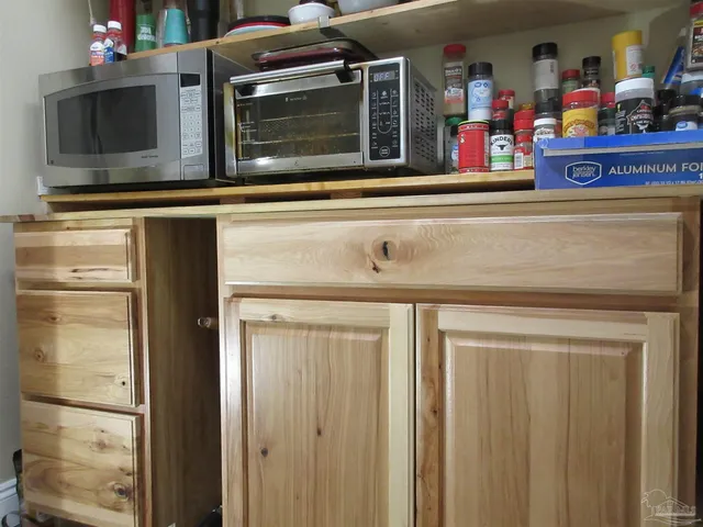 a bedroom with a bed and flat screen tv