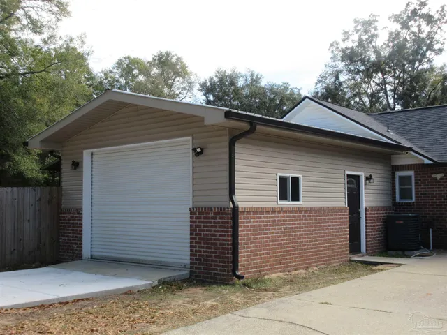 a bedroom with furniture and a flat screen tv