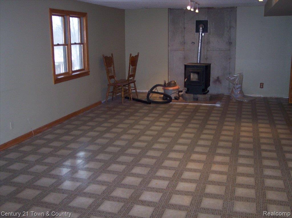 1175 Baker Road Fenton, MI 48430 - Photo 10 of 16 Prof Finished LL with Woodburner