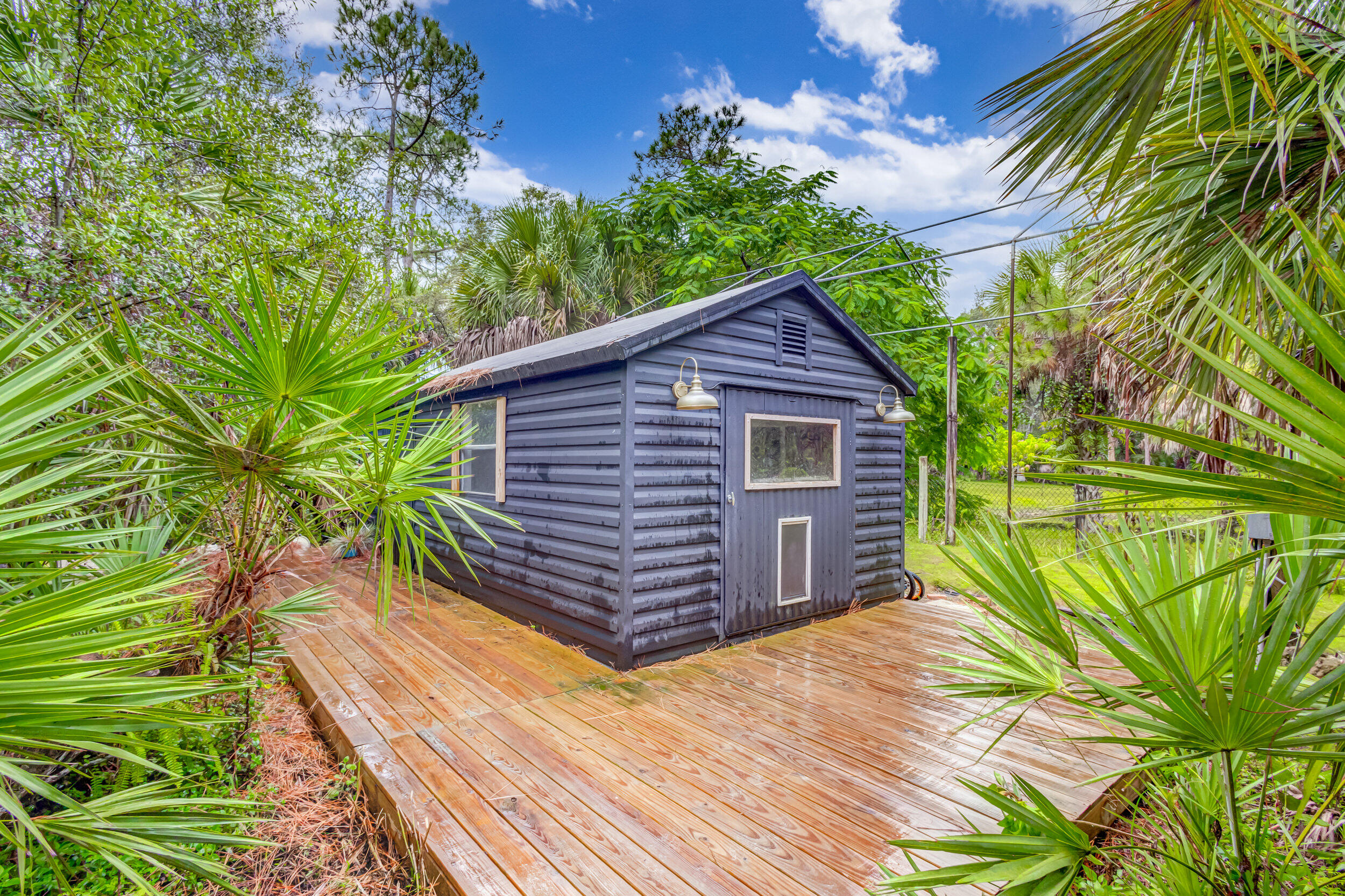 13578 Edith Road Loxahatchee Groves, FL 33470 - Photo 42 of 69 29b Ext Bldg Office Storage Wrap Deck