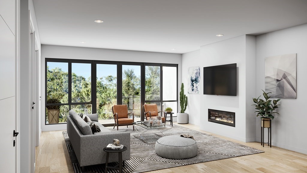 a living room with furniture fireplace and a flat screen tv