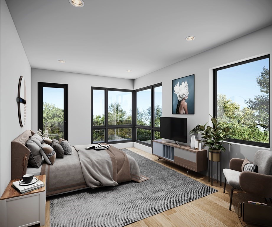 41 University Road, Unit 1 Brookline, MA 02445 - Photo 3 of 6 a living room with furniture flat screen tv and a large window