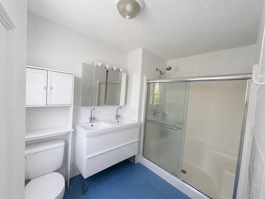 38 Crescent Road, Unit 38 Needham, MA 02494 - Photo 16 of 23 a bathroom with a sink toilet and shower