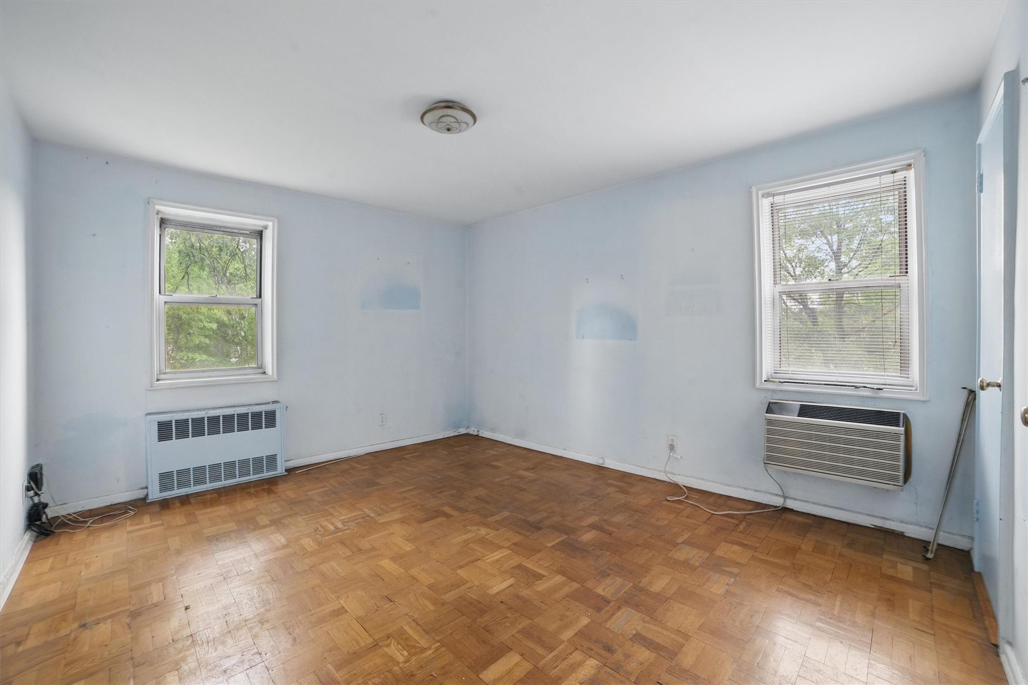 682 Tuckahoe Road, Unit 1A Yonkers, NY 10710 - Photo 14 of 17 an empty room with windows