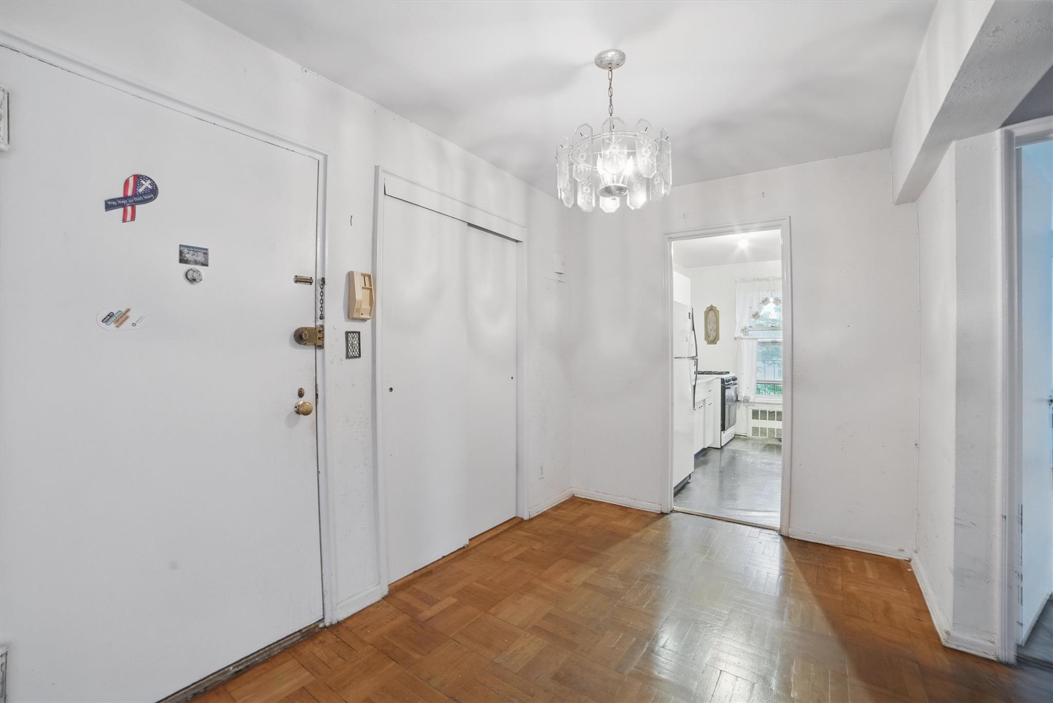 682 Tuckahoe Road, Unit 1A Yonkers, NY 10710 - Photo 4 of 17 a view of a chandelier in a room