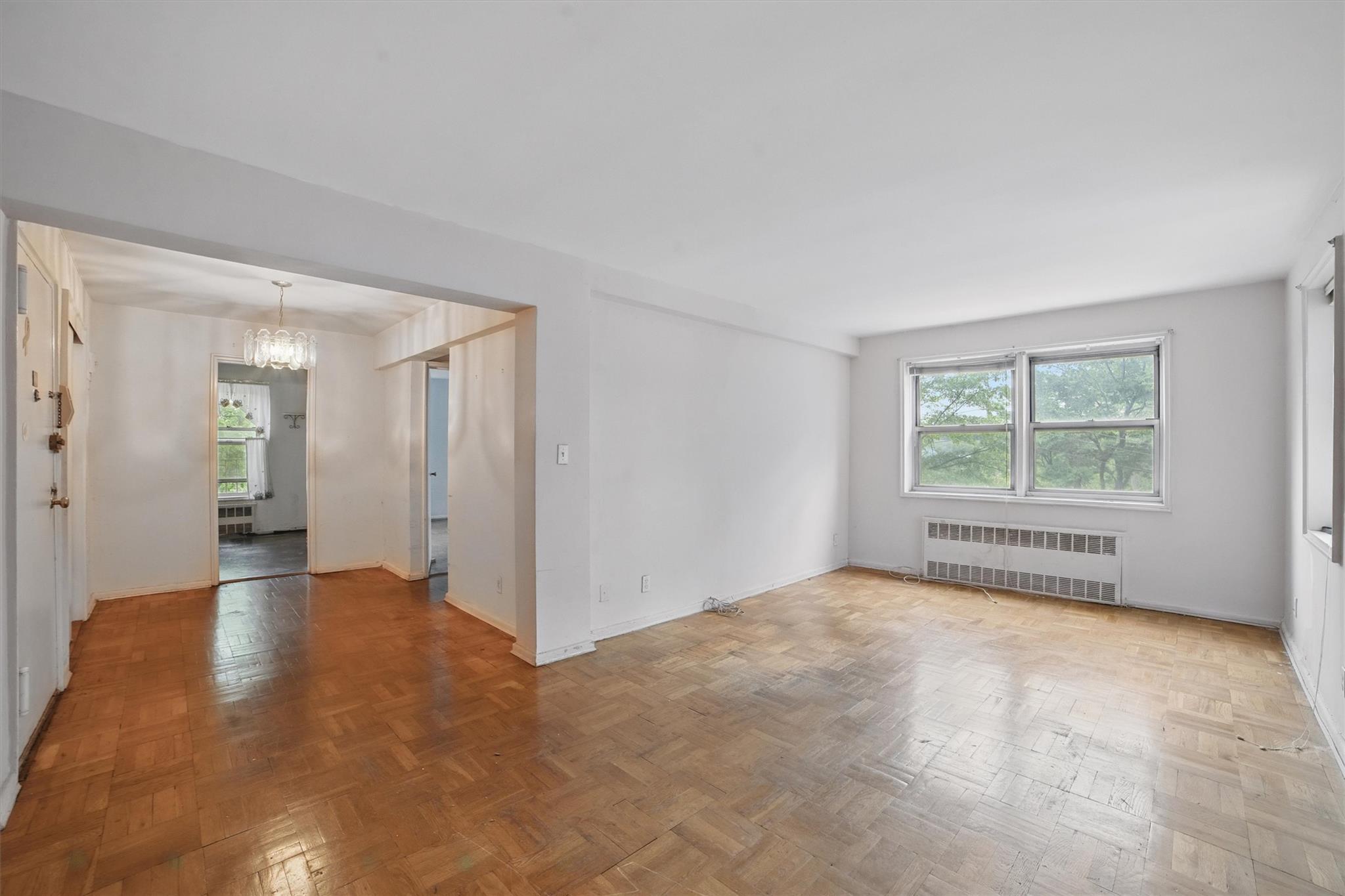682 Tuckahoe Road, Unit 1A Yonkers, NY 10710 - Photo 6 of 17 a view of an empty room with a window