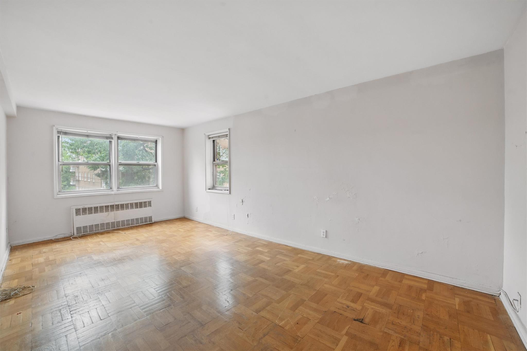 682 Tuckahoe Road, Unit 1A Yonkers, NY 10710 - Photo 7 of 17 an empty room with windows