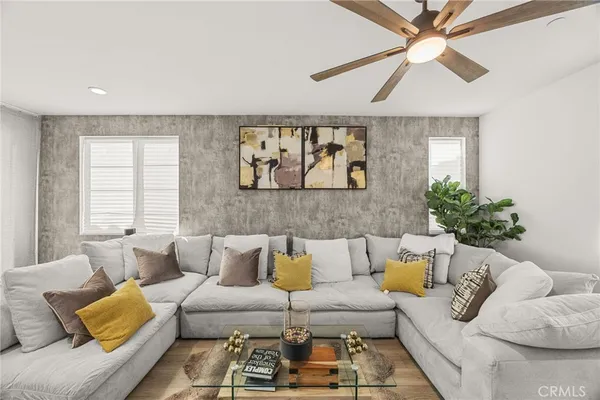 a living room with furniture and a large window