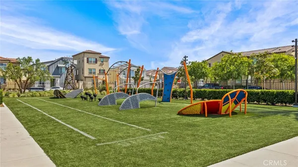 a view of a playground with basketball court