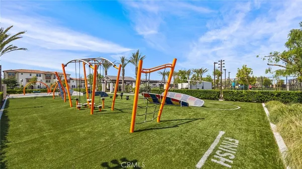 a view of a playground with basketball court