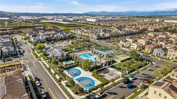an aerial view of residential building and lake