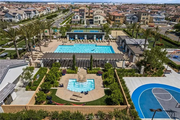 an aerial view of a house with swimming pool garden and patio