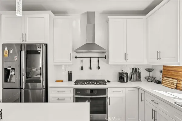 a kitchen with a stove and cabinets