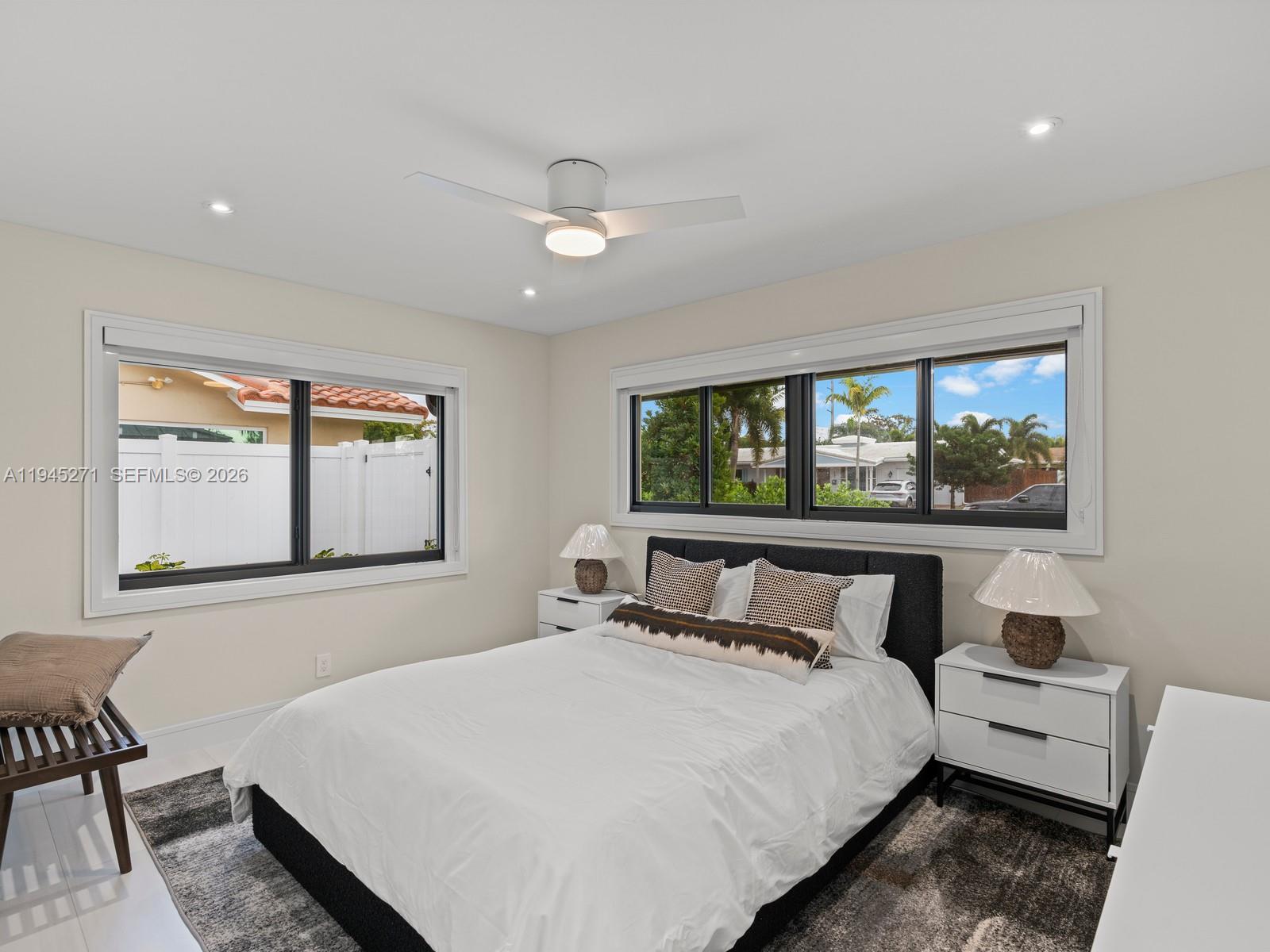 511 Southeast 14th Street, Unit 1 Pompano Beach, FL 33060 - Photo 14 of 20 a bedroom with a large bed and a window