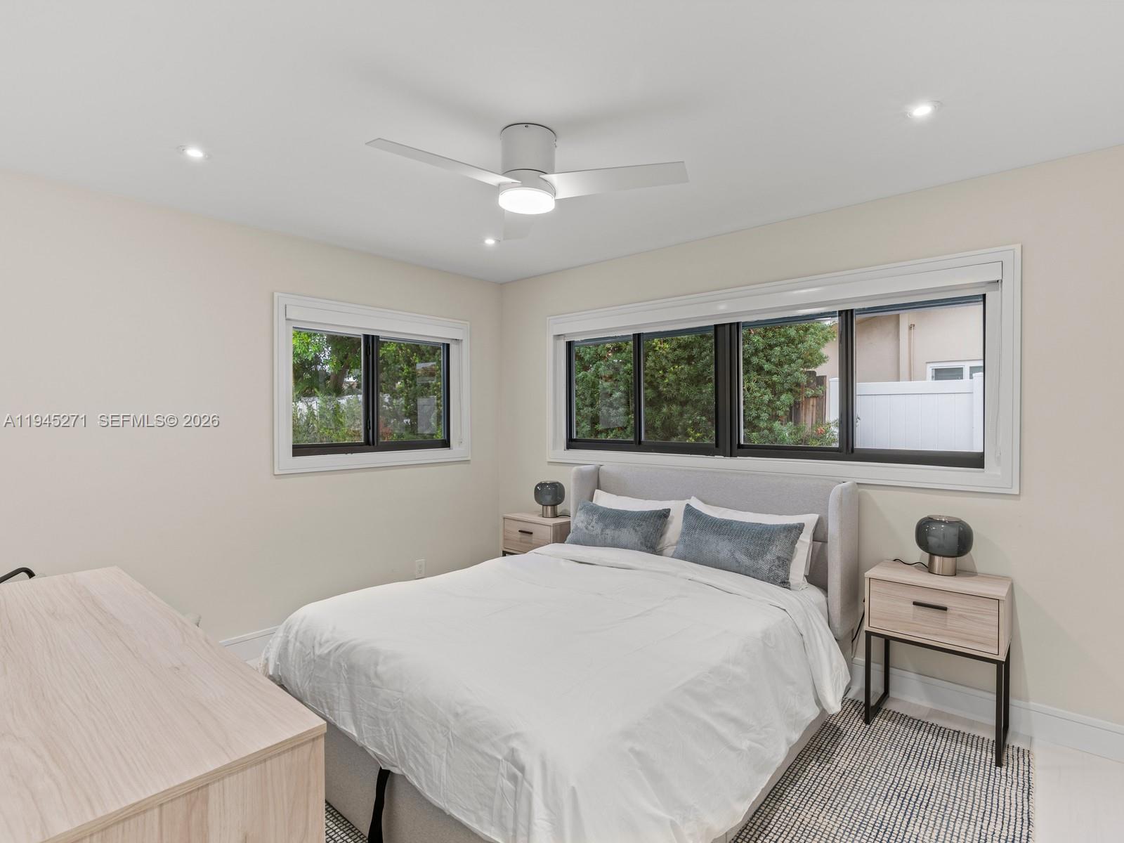 511 Southeast 14th Street, Unit 1 Pompano Beach, FL 33060 - Photo 15 of 20 a bedroom with a large bed and a window