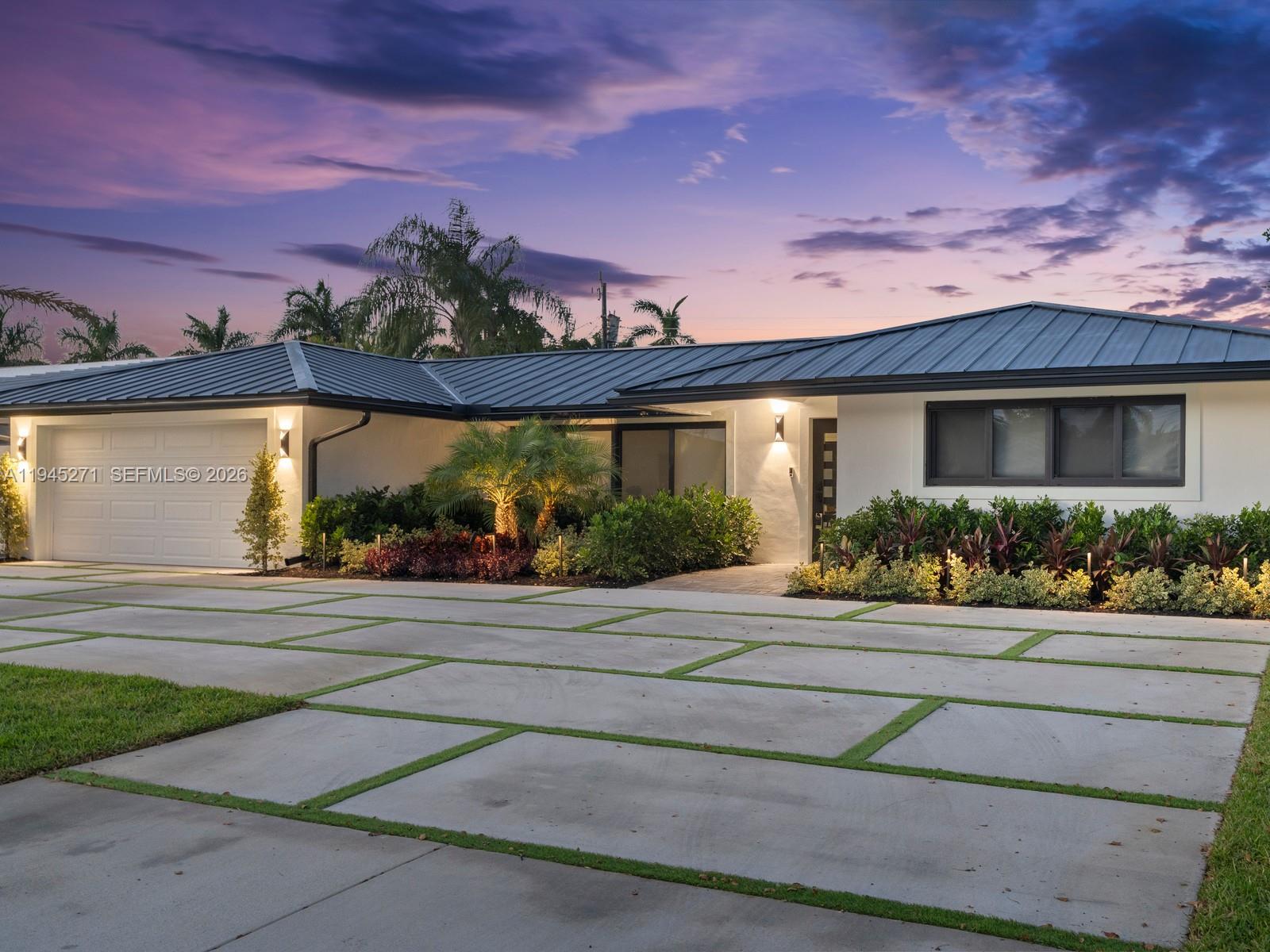 511 Southeast 14th Street, Unit 1 Pompano Beach, FL 33060 - Photo 3 of 20 a front view of a house with a yard