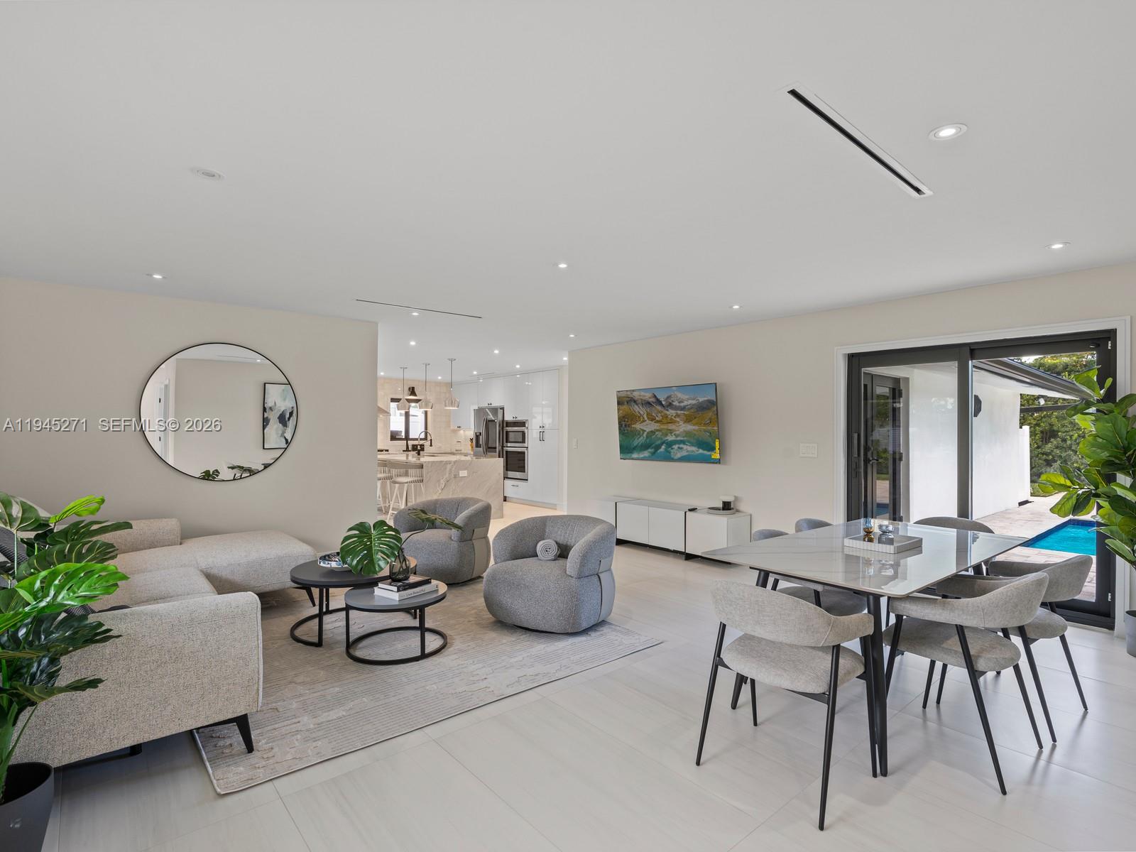 511 Southeast 14th Street, Unit 1 Pompano Beach, FL 33060 - Photo 6 of 20 a living room with furniture potted plant and a large window